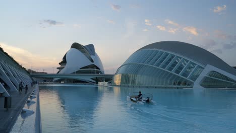 Pedalo-boat-at-The-City-of-Arts-and-Sciences,-The-Hemisferic-cinema-in-Valencia,-Spain