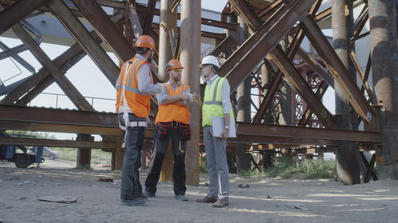 Construction Workers Discussing Bridge Project