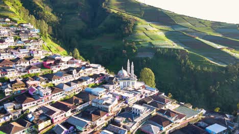 Aerial-view-of-mosque-with-two-tower-on-the-middle-of-village-house---Baituttaqwa-mosque-on-Nepal-Van-Java-on-the-slope-of-Mount-Sumbing,-Indonesia