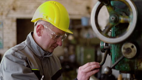 man checking machinery