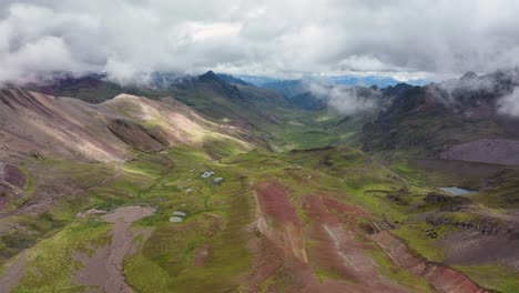 Aerial-fly-drone-view-of-Rainbow-Mountain-,-Vinicunca,-Cusco-Region,-Peru