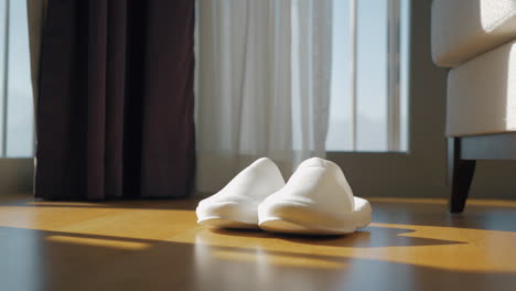 white slippers on a wooden floor