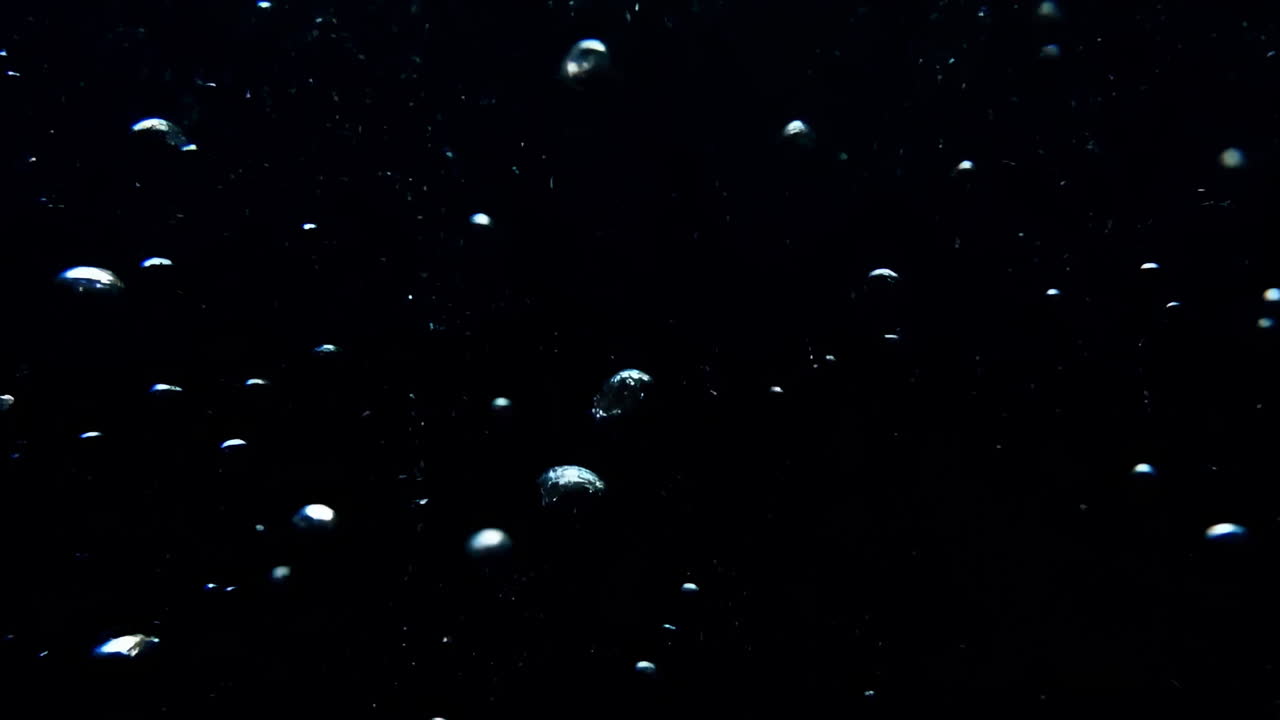 Black Underwater Rising Bubbles Shimmering, Air Spheres Ascend Through Dark Liquid With Reflective Highlights,