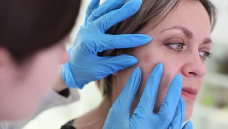 dermatologist conducting a skin examination on a patient