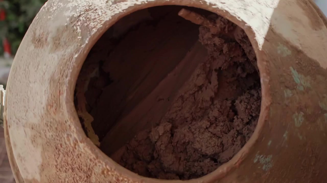 Cement mixer machine mixing concrete solution for construction. Detailed view of an old rusty cement mixer mixing concrete
