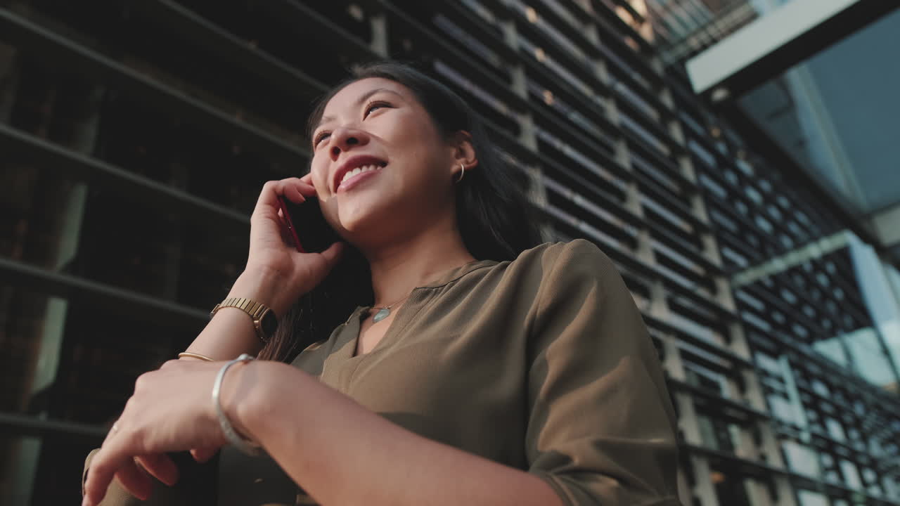 Businesswoman Talking on Cell Phone in City