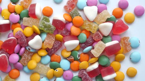 a colorful assortment of candies, including chocolate, gummies, and jelly beans.