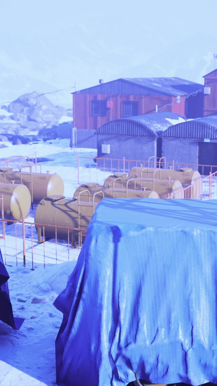 Exploration base nestled in icy terrain under a hazy blue sky