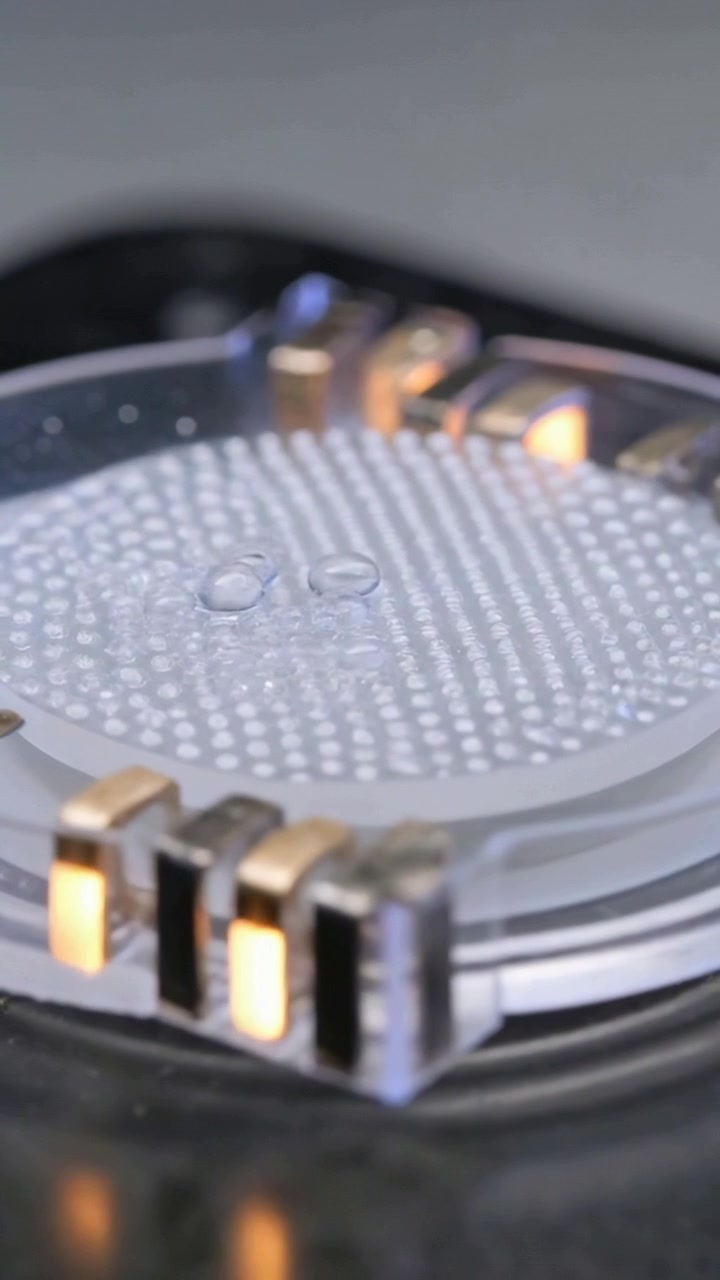Vertical video: Camera capturing closeup translucent disc in lab after focus shift