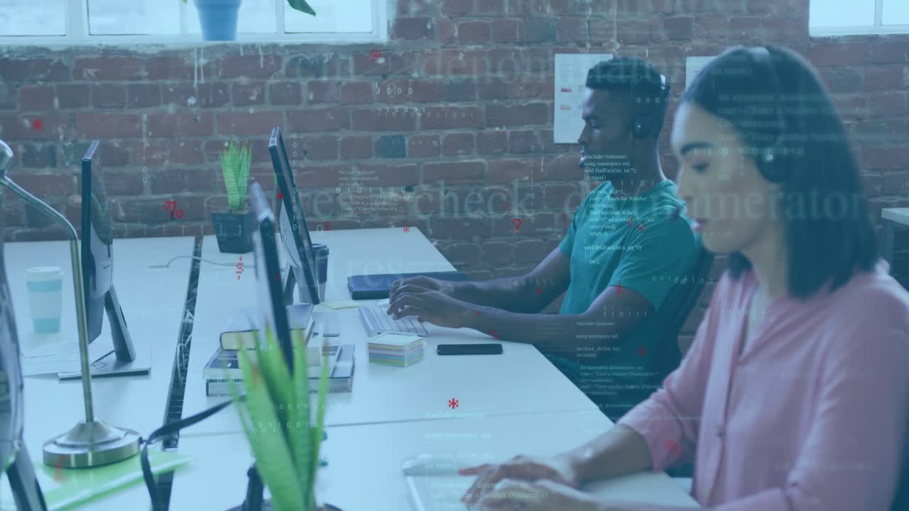 Developers starting typing at shared desk creating live code overlays improving workflow clarity