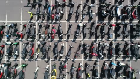 aerial comparison of empty parking spaces transforming into a crowded bicycle station, highlighting urban mobility and sustainable transportation trends