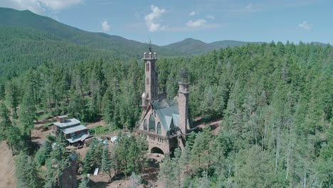 Drone-view-of-a-castle-style-building-in-countryside-of-Colorado