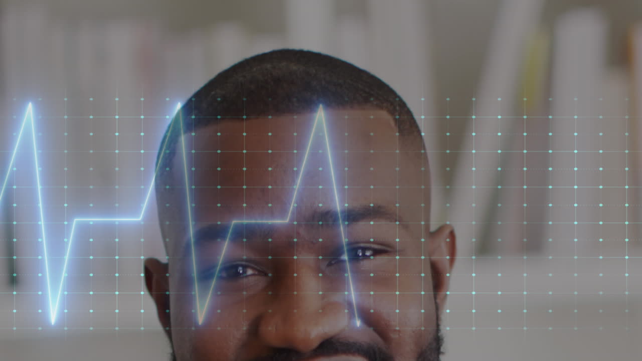 Animation of heart rate monitor against half face portrait of african american male doctor smiling