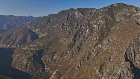 Tolantongo-Mexico-Aerial-v15-cinematic-shot-drone-flyover-and-around-canyon-capturing-spectacular-mountainscape-and-the-natural-beauty-of-mother-earth---Shot-with-Mavic-3-Cine---December-2021