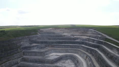 arial drone flight over breedon hope cement works in the peak district national park giving a view of the stone quarry