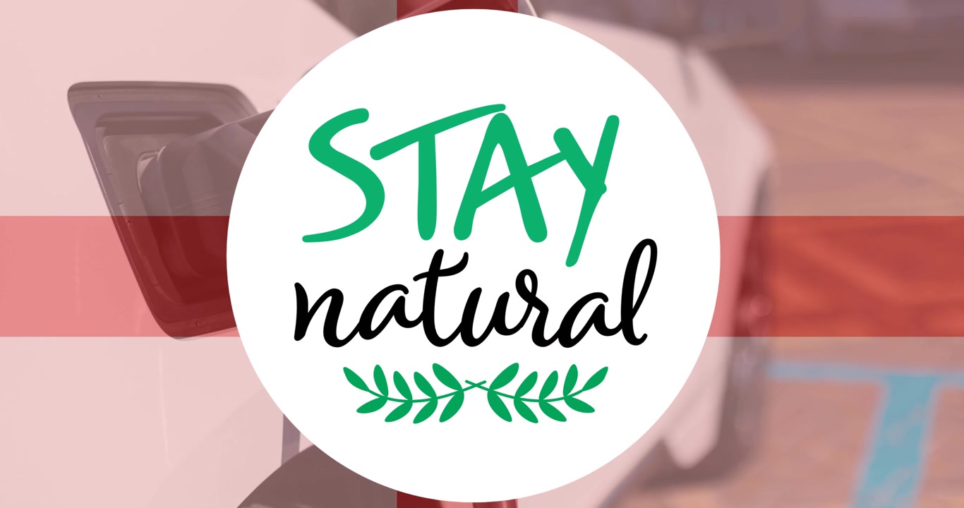 Stay natural text over flag of england and charging electric car