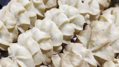 close-up shot of freshly baked butter cookies with a golden texture resting on a baking tray