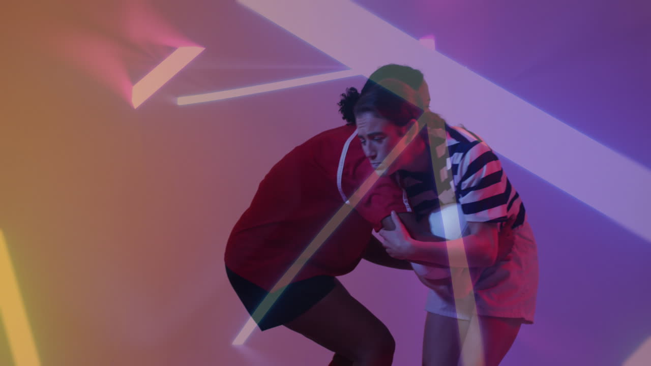 Animation of neon pattern over female rugby players on neon background