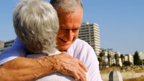 Senior-couple-embracing-each-other-near-seaside-4k