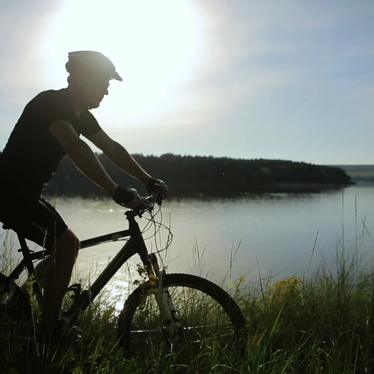 Cyclist Riding At Sunset