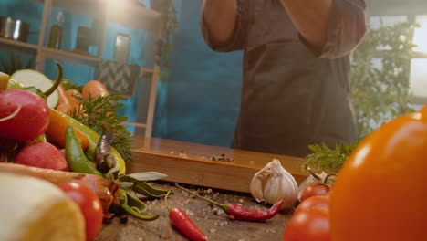assortment of fresh vegetables on a wooden cutting board
