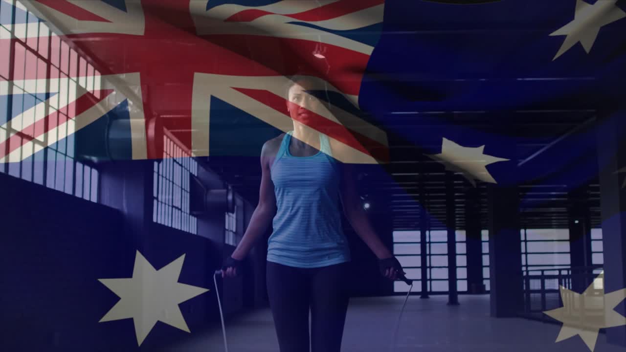 Woman rotating wrists, starting rope swing and skipping for fitness while AUS flag overlaying frame