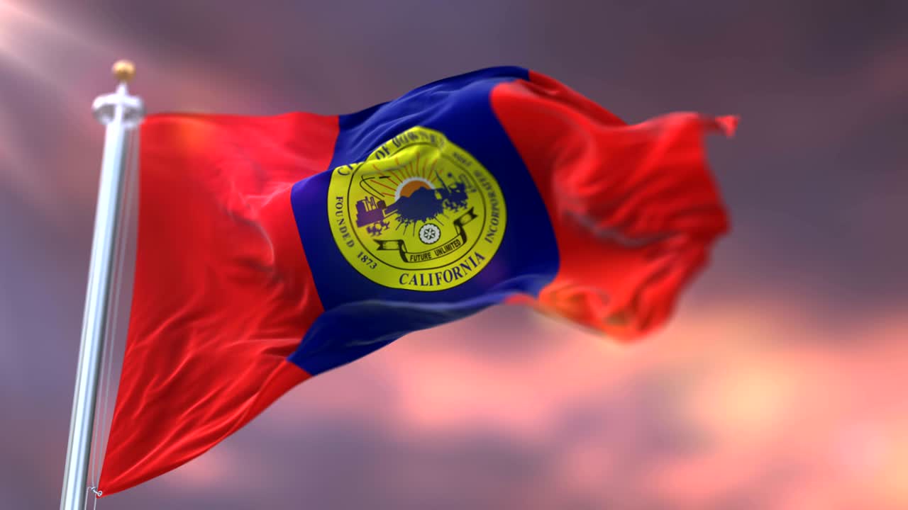 bandera de downey al atardecer, ciudad de california en los estados unidos de américa - bucle