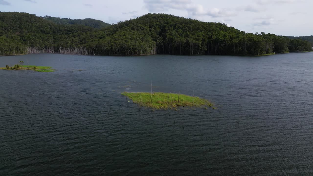Circular aerial views of a small island on Advancetown Lake near the Western Boat Ramp on the Gold Coast Hinterland.