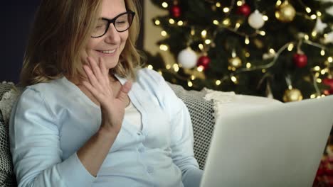 handheld video of senior woman during video call.