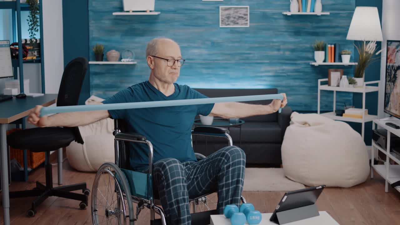 Old person with disability pulling resistance band to stretch