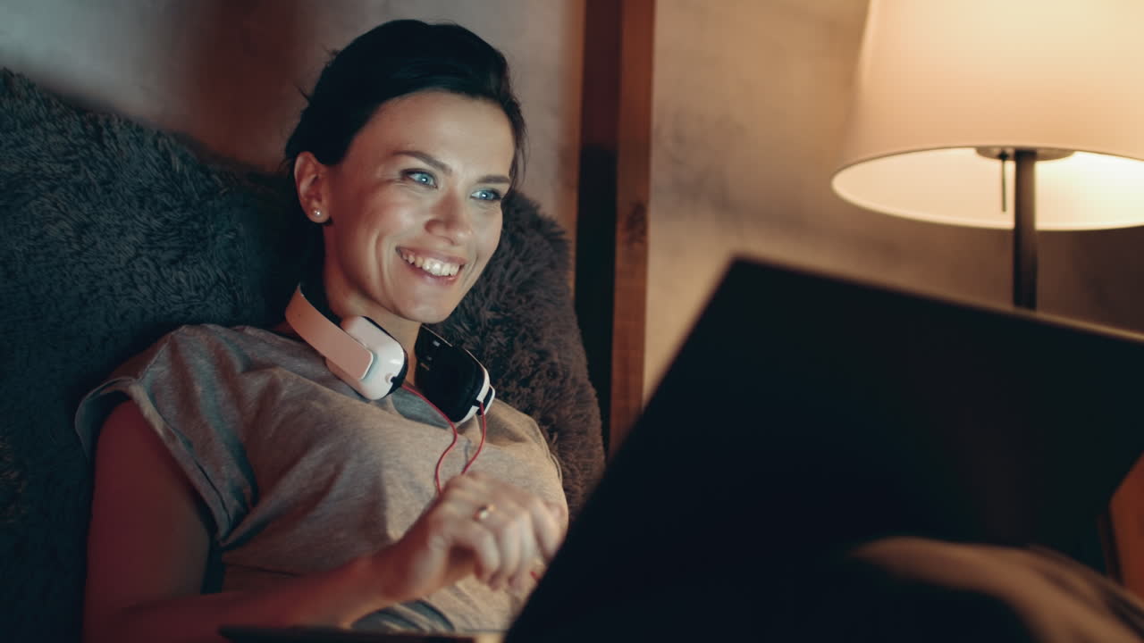 Woman starting video call on laptop.