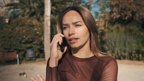 upset young woman talking on the phone.