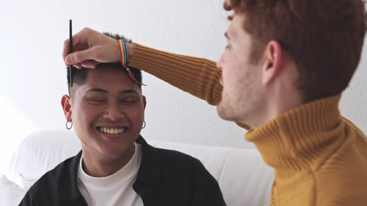 A couple applying makeup