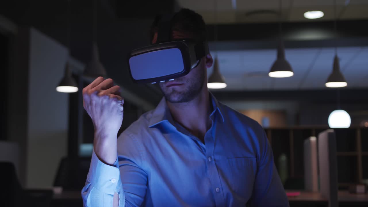 Businessman using VR helmet in a modern office