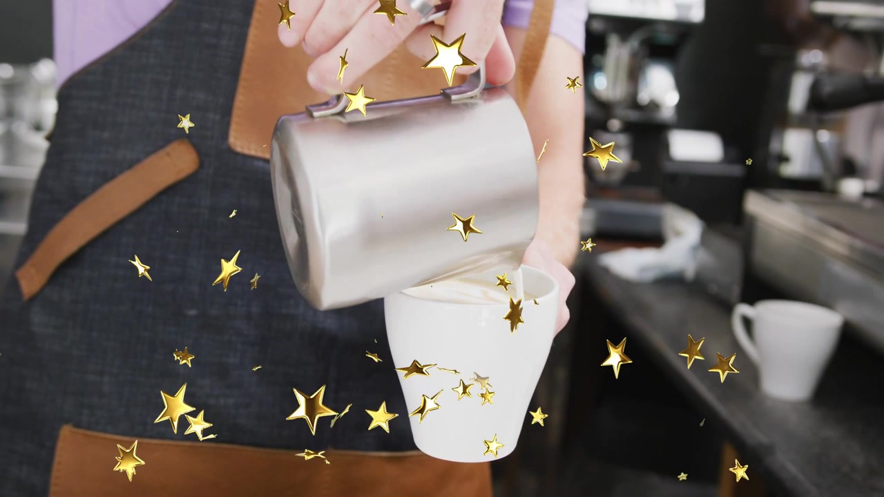 Steam wand retracting, barista pouring milk and shaping latte art to prepare coffee cup