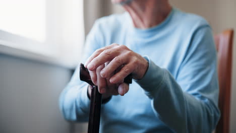 senior man holding cane
