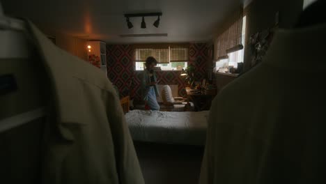 woman reading in a cozy dorm room