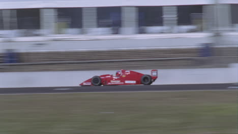 formula cars compete on a circuit track 1