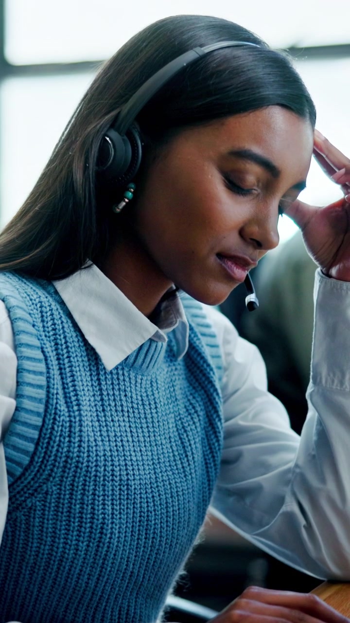 Stressed Customer Service Representative Working in Office