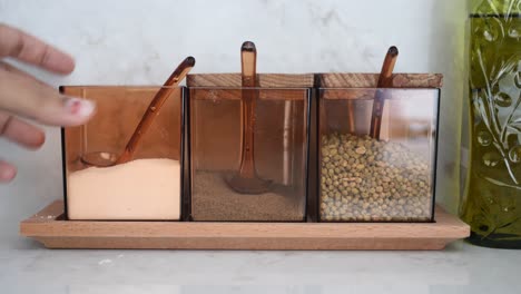 spice jars on a wooden tray