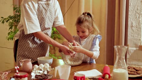 grandmother and granddaughter baking together