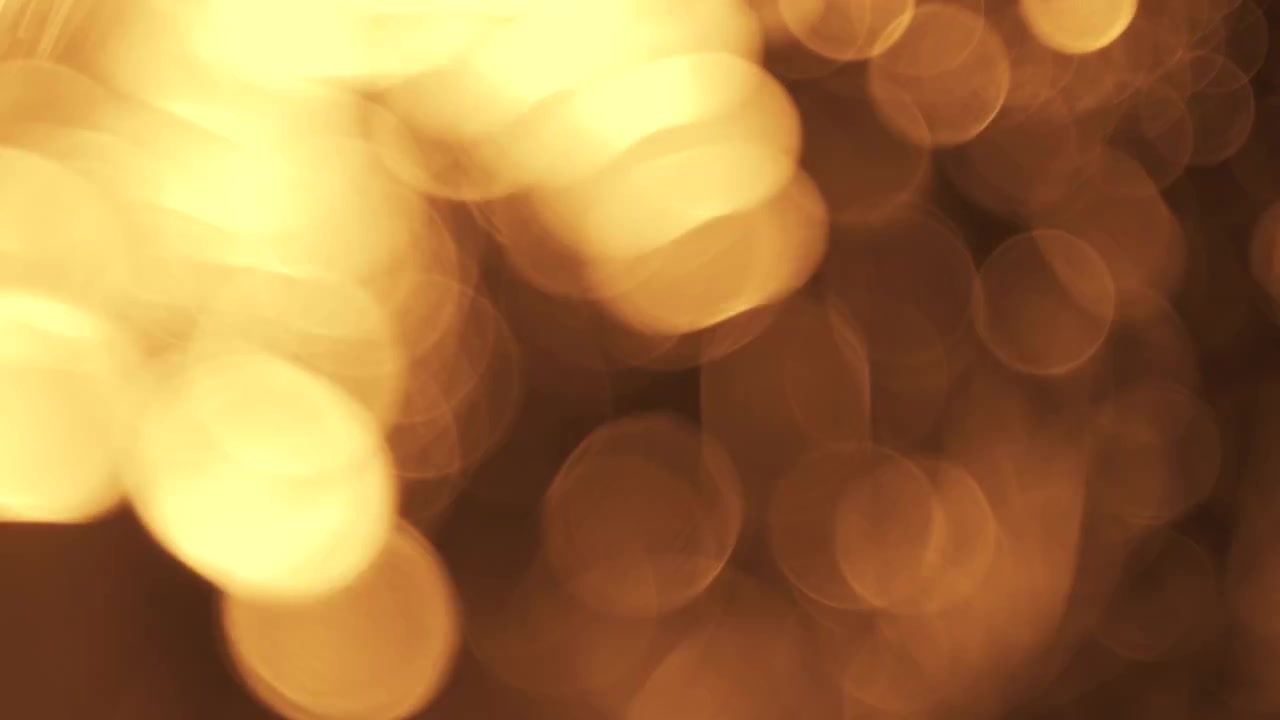 Transizione astratta di sfondo bokeh con luce dorata