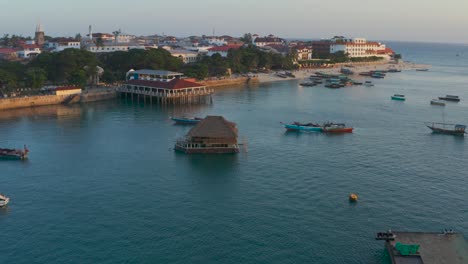 drone pivoting wide on floating restaurant