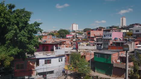 Aerial-landscape-image-of-favela-football-field---Flying-over-slum-in-district-of-Campo-Limpo,-São-Paulo-City-in-Brazil