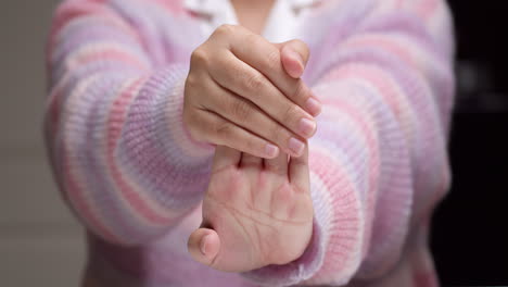 woman hand has office syndrome and relaxation arthritis with self-massage stretching finger reflexology