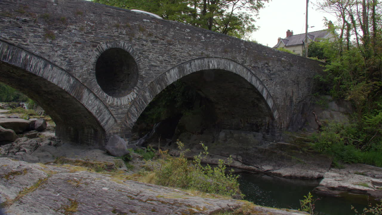 shot of the Cenarth bridge arch that crosses the river Teifi at Cenarth Falls
