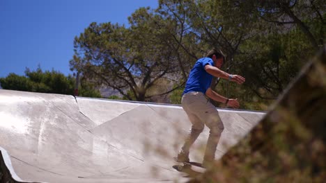 skateboarder does a trick on a halfpipe in santorini greece