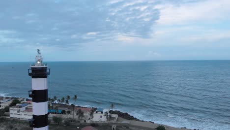 4k aerial view of a lighthouse near the port harbor shot with a drone in pondicherry, india