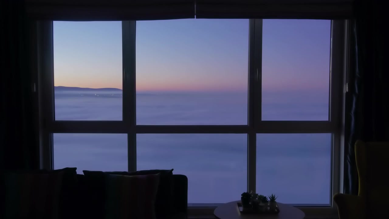 Time Lapse of Sunrise Over Clouds Seen From Apartment Window