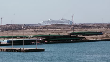 large cruiseship entering the suez canal on a sunny day in port said